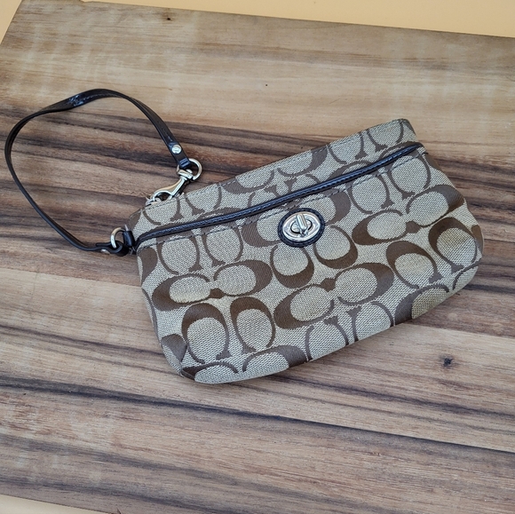 Coach Handbags - Coach Brown and Tan Signature Logo Wristlet with Front Pocket